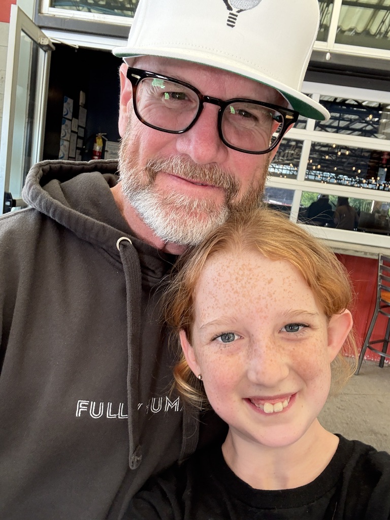 Kent and Delila in a fullyhuman.ai hoodie